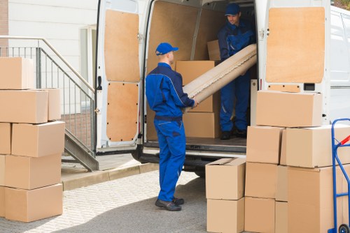 Local man and van moving boxes in Richmond Upon Thames
