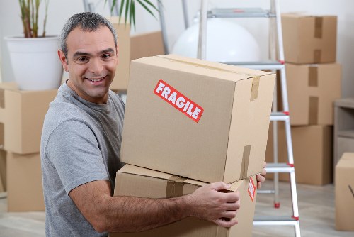 Professional man with van loading furniture for a Richmond upon Thames move