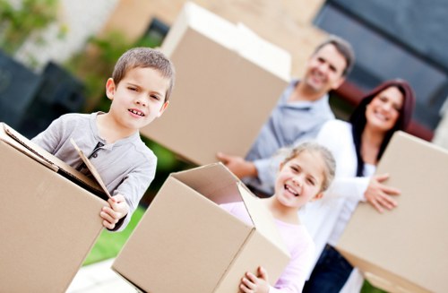 Professional movers handling household items during a same day relocation