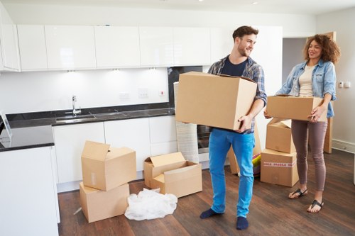 Professional movers handling a stairwell move in a Richmond Upon Thames apartment building
