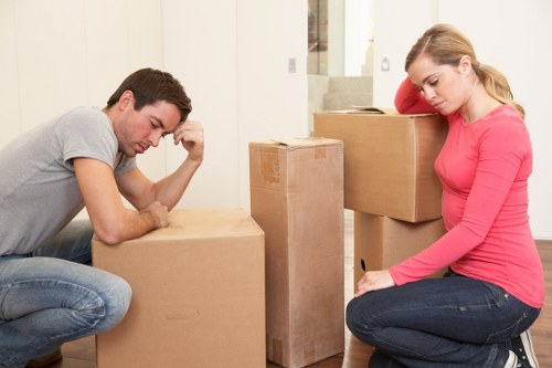 Manager checking supplier records for worker standards